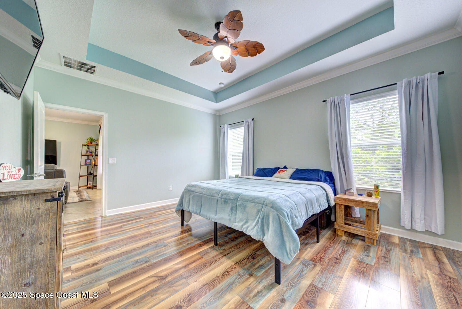 3142 Dark Sky Drive Harmony, FL 34773 - Photo 44 of 54 a bed sitting in a bedroom next to a window