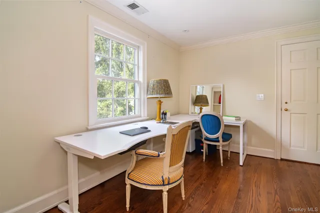 a spacious bathroom with a tub sink and mirror