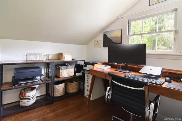 a bedroom with a bed chair and window