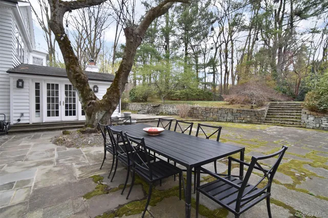 a living room with furniture a window and a fireplace