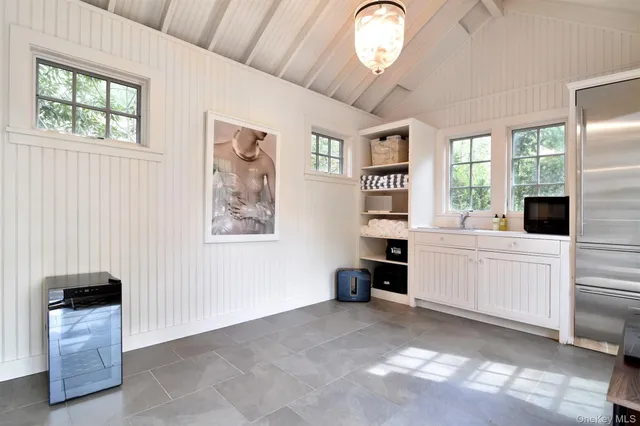 a view of a swimming pool with a yard