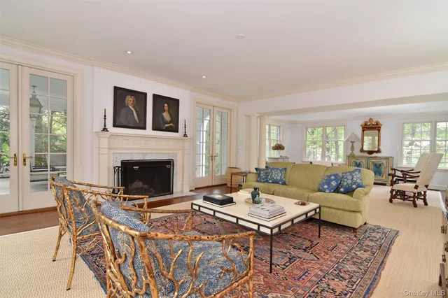 a view of entryway with furniture and wooden floor