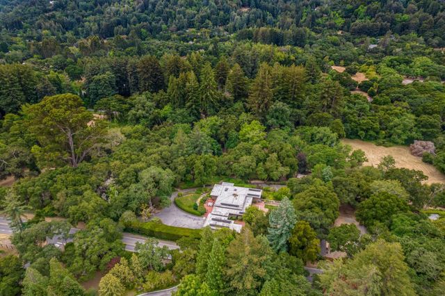 a aerial view of a house with a yard