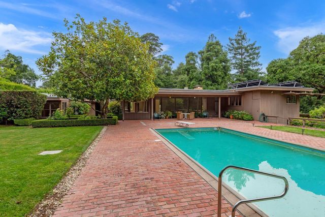 a view of a swimming pool with a patio