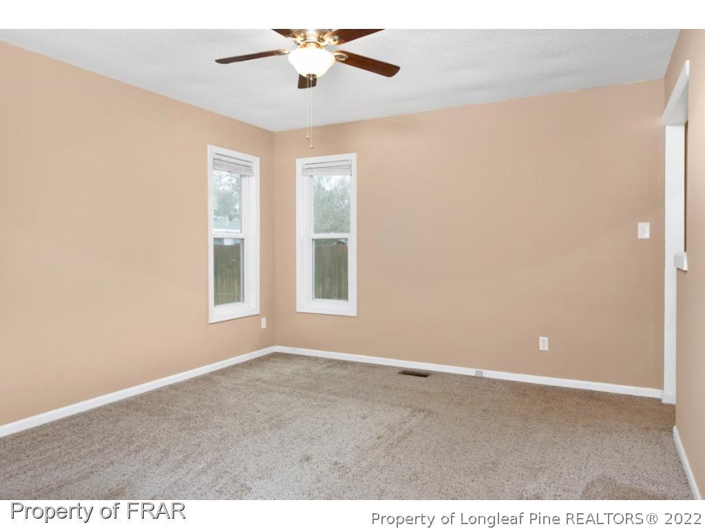 5913 Hunting Ridge Road Hope Mills, NC 28348 - Photo 13 of 20 a view of an empty room with a window