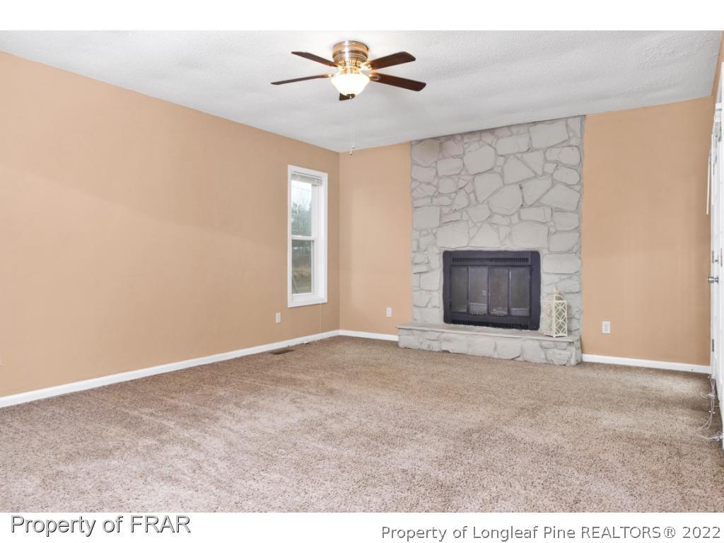5913 Hunting Ridge Road Hope Mills, NC 28348 - Photo 4 of 20 a view of empty room with a fireplace