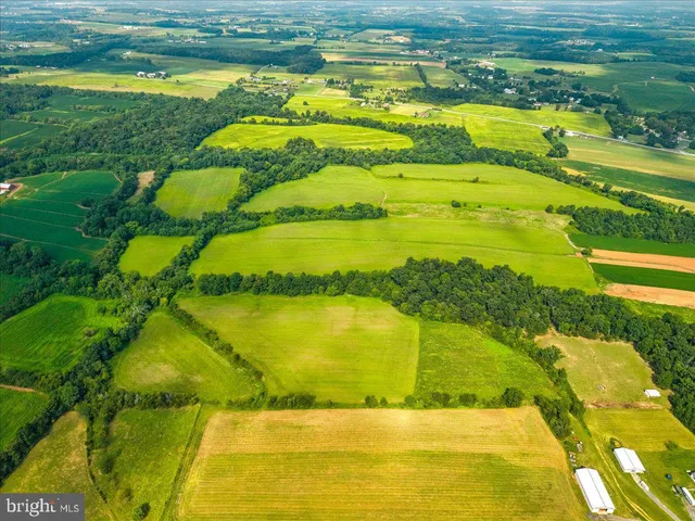 a view of an swimming pool with outdoor seating and yard