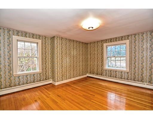 245 Great Road Stow, MA 01775 - Photo 12 of 35 an empty room with wooden floor and windows