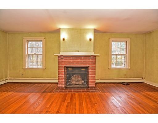 245 Great Road Stow, MA 01775 - Photo 4 of 35 a view of empty room with wooden floor and fireplace