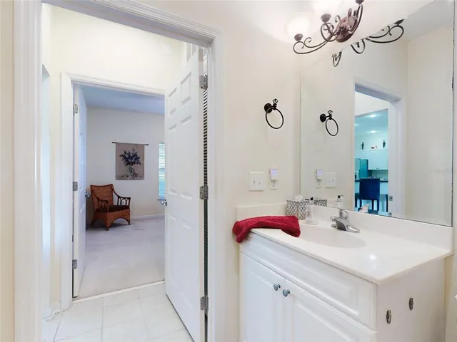 a en suite bathroom with a sink and a mirror
