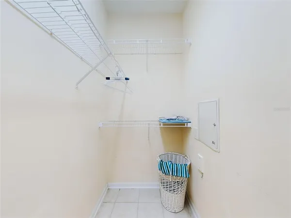 a view of storage and utility room with racks on the wall