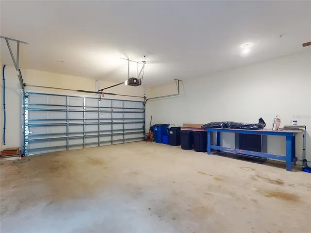 a view of a room with furniture and a window