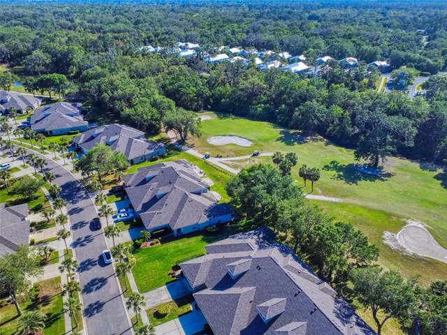 an aerial view of a house with a garden
