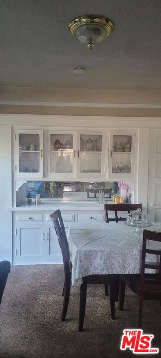 5102 Cimarron Street Los Angeles, CA 90062 - Photo 4 of 8 a living room with granite countertop furniture and kitchen view