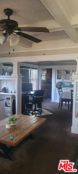 5102 Cimarron Street Los Angeles, CA 90062 - Photo 5 of 8 a living room with furniture and a fireplace