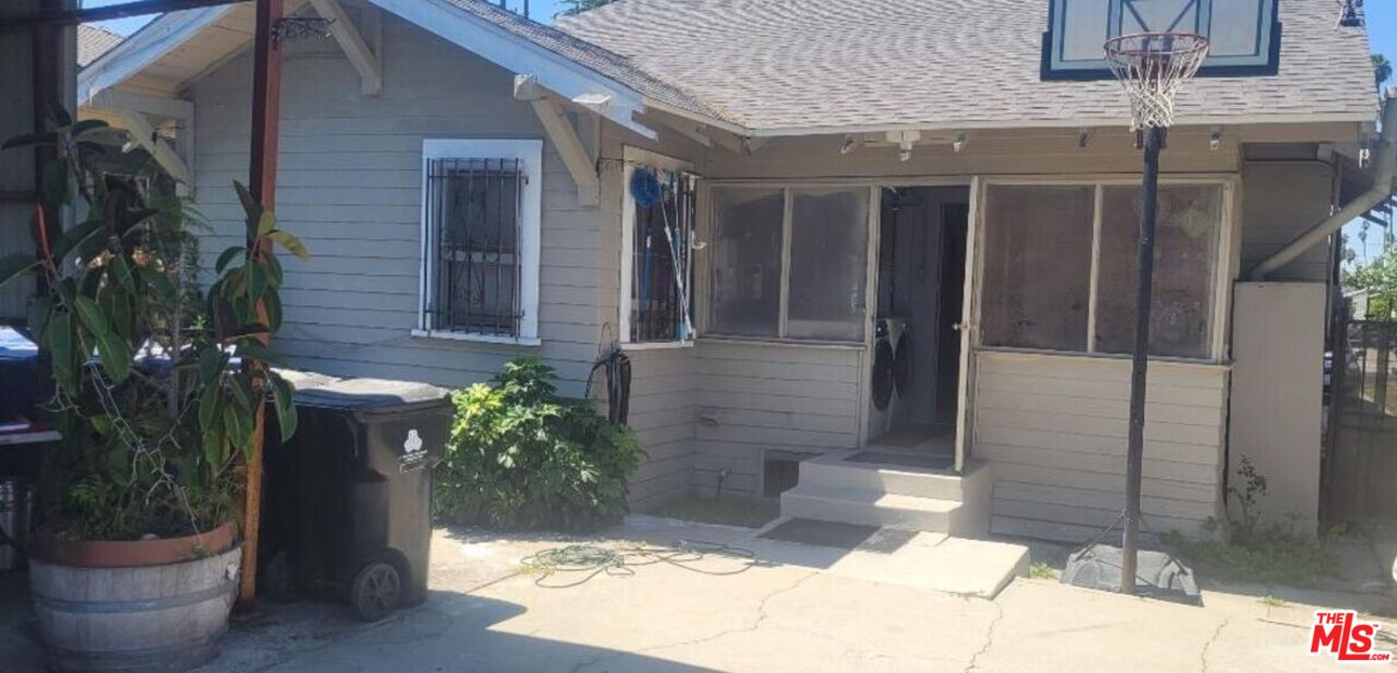 5102 Cimarron Street Los Angeles, CA 90062 - Photo 8 of 8 a front view of a house