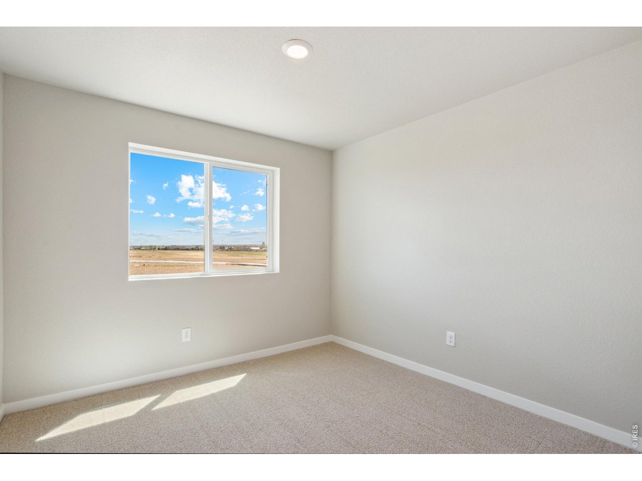 7465 Slate Place Frederick, CO 80530 - Photo 13 of 28 an empty room with a window