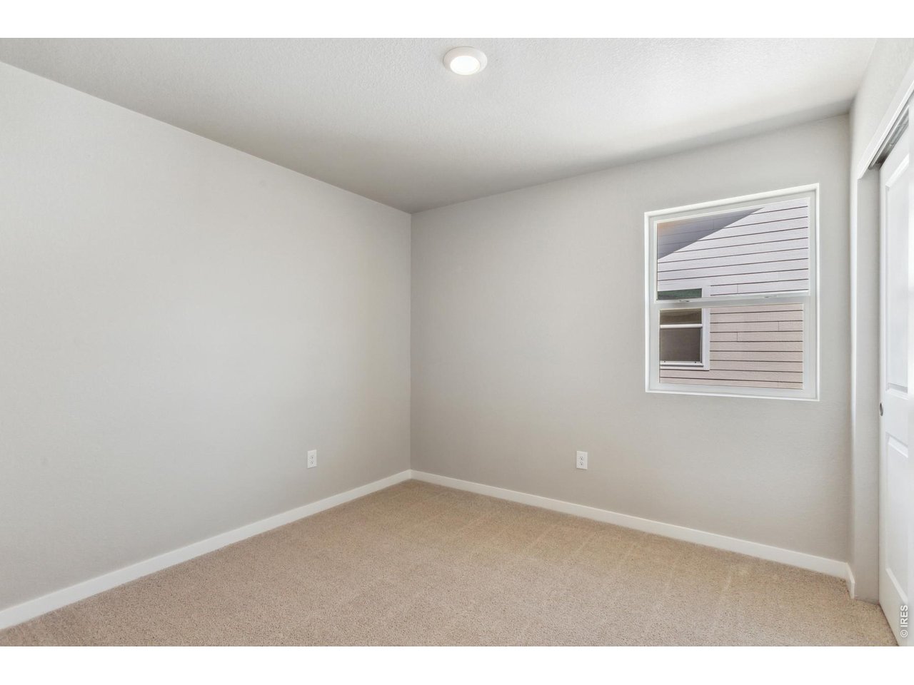 7465 Slate Place Frederick, CO 80530 - Photo 15 of 28 a view of an empty room with a window