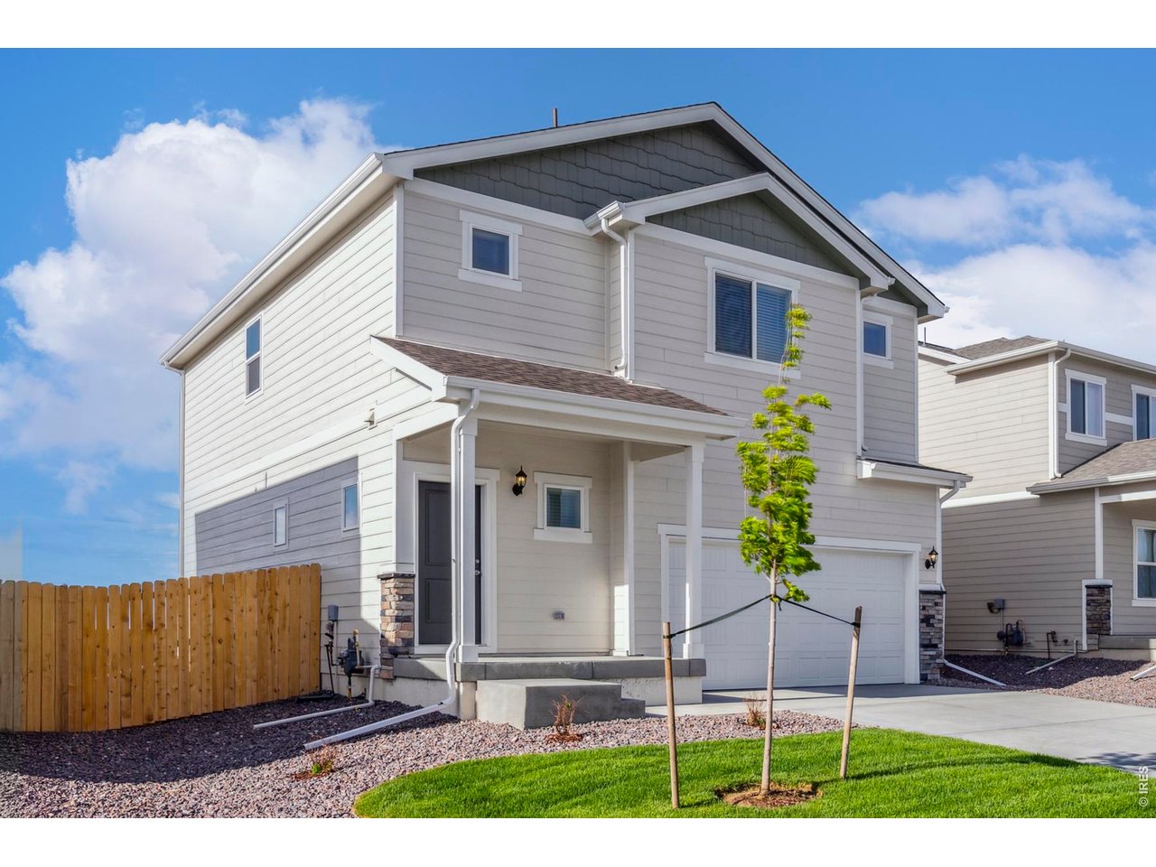 7465 Slate Place Frederick, CO 80530 - Photo 2 of 28 a view of a small house with yard