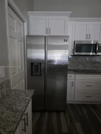 a kitchen with a stove and cabinets