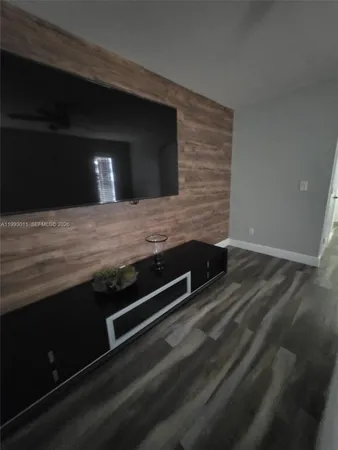 a bedroom with a bed and a mirror