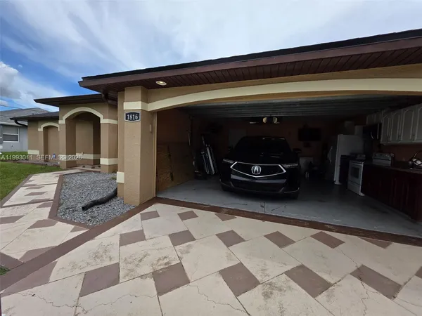 a car parked in front of a house