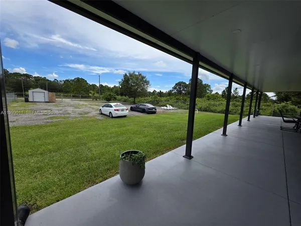a view of a big yard with a house