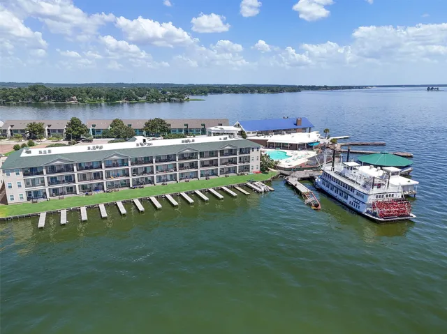 a view of a lake with a table and chairs