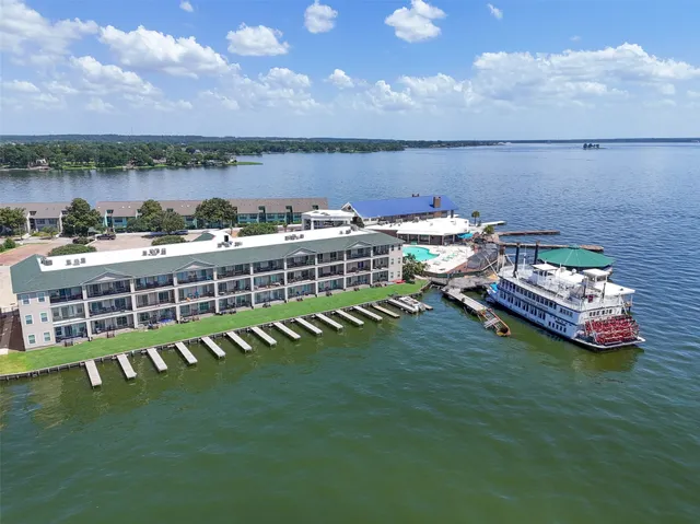 a view of a lake with a table and chairs