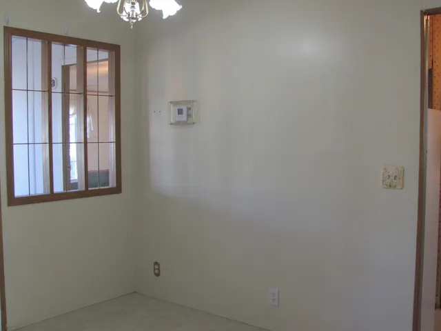 a view of an empty room with a balcony