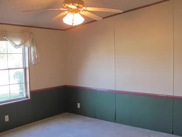 a view of a room that has a large window