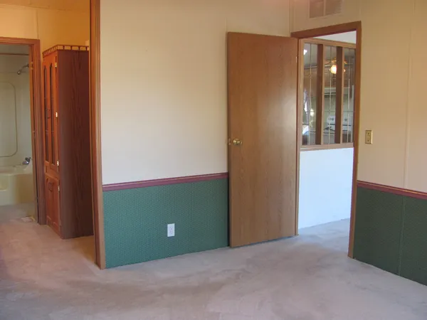 a bathroom with a granite countertop shower and a sink