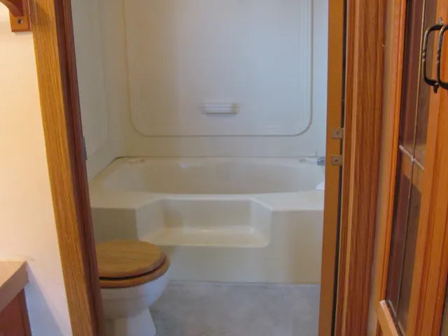 a view of a wooden deck with a yard