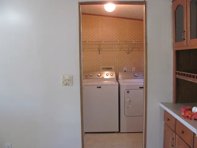 a utility room with dryer and washer