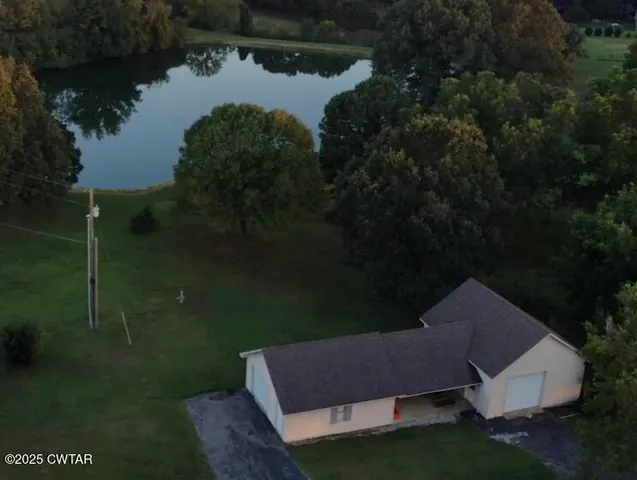a view of outdoor space with deck and trees