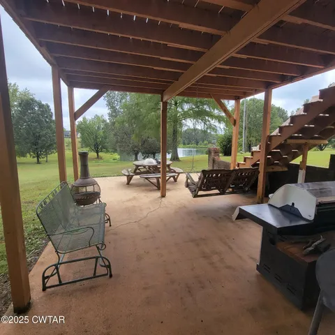 a view of a livingroom with a black and white checkered floor with a rug
