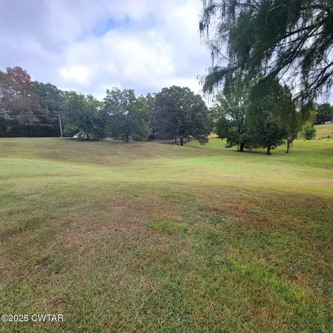 a view of an empty room with a fireplace