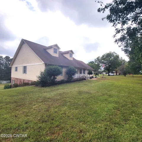 a kitchen with a stove a sink a microwave and a refrigerator