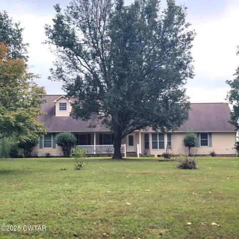 a view of a dining room with furniture and window