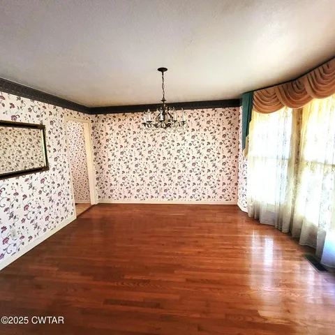 a bedroom with a bed and a table