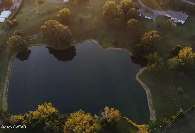 a view of house with outdoor space and garden