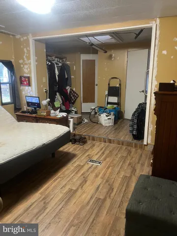 a bedroom with furniture and a bed