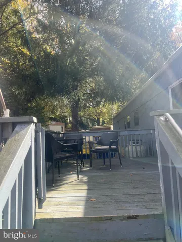 a view of a patio with table and chairs