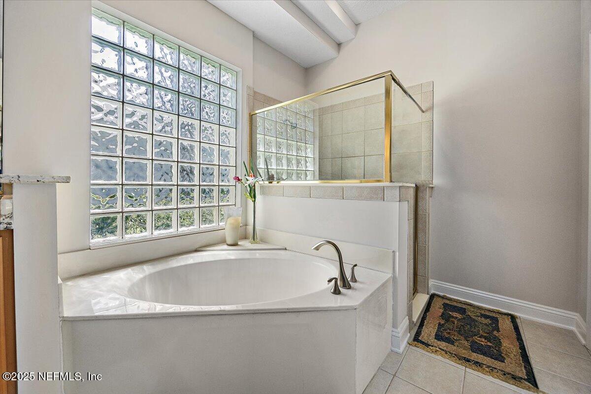 760 Mill Stream Road Ponte Vedra Beach, FL 32082 - Photo 14 of 34 a bath tub sitting next to a window