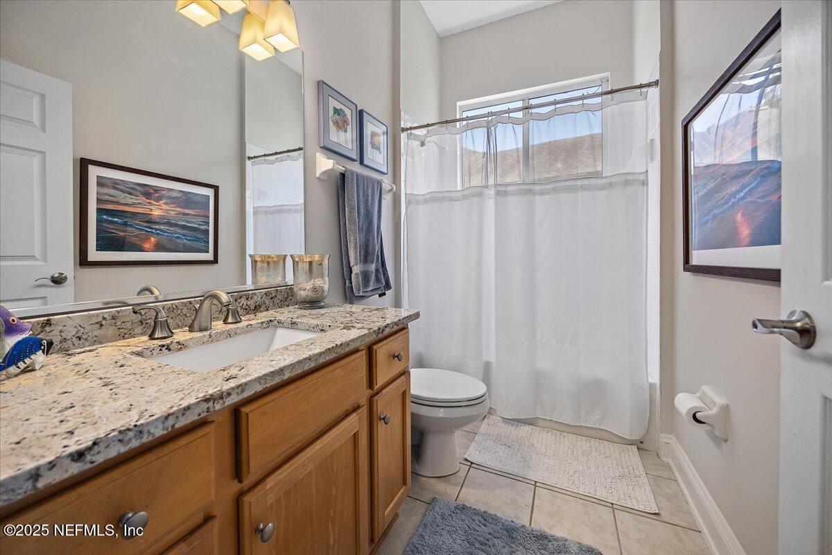 760 Mill Stream Road Ponte Vedra Beach, FL 32082 - Photo 16 of 34 a bathroom with a granite countertop sink toilet and shower