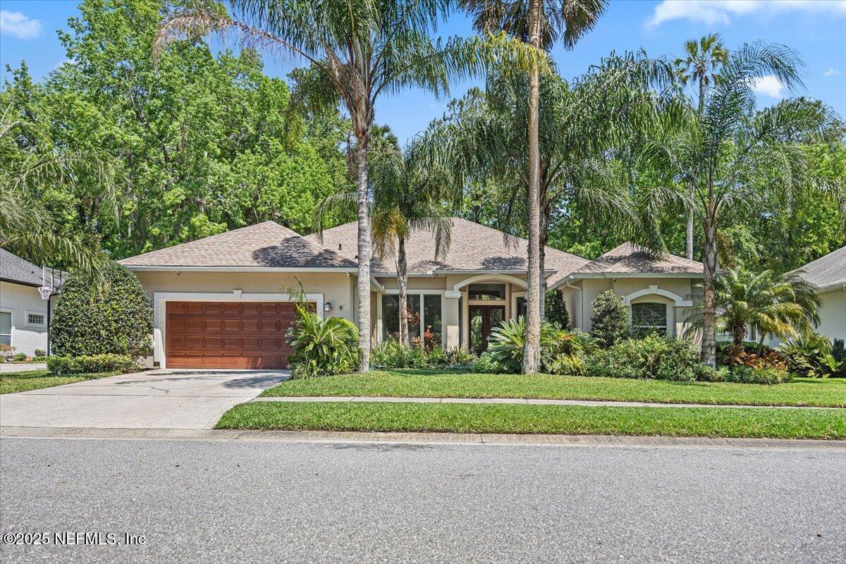 760 Mill Stream Road Ponte Vedra Beach, FL 32082 - Photo 25 of 34 a front view of a house with a garden