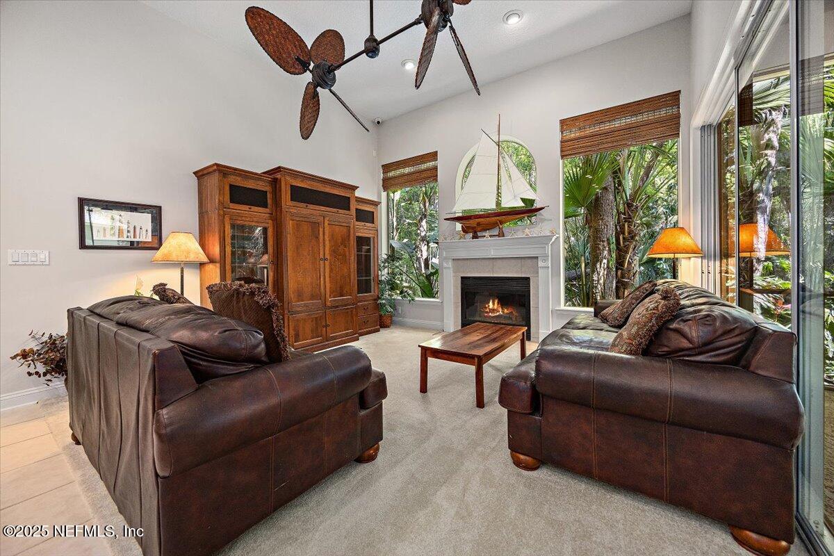 760 Mill Stream Road Ponte Vedra Beach, FL 32082 - Photo 9 of 34 a living room with furniture fireplace and flat screen tv