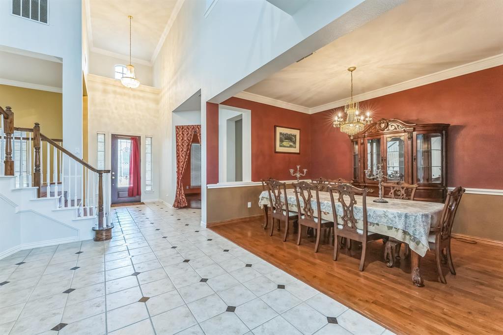 1611 Long Prairie Court Allen, TX 75002 - Photo 11 of 32 a view of a dining room with furniture window and wooden floor