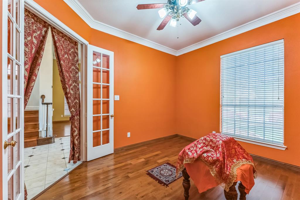 1611 Long Prairie Court Allen, TX 75002 - Photo 14 of 32 a bedroom with a bed and a window