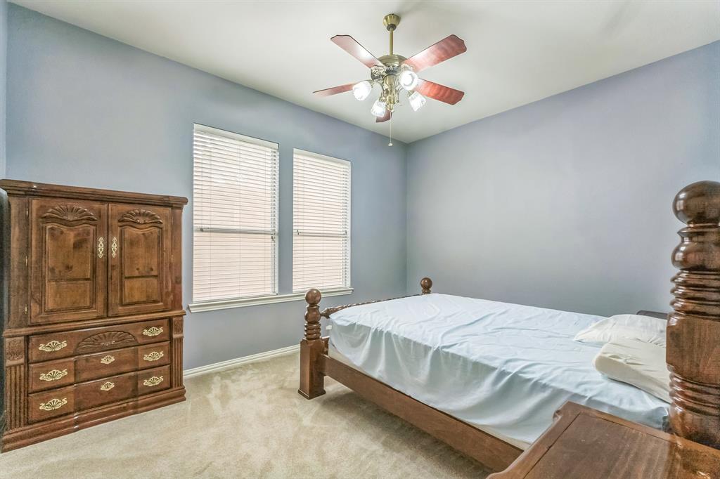 1611 Long Prairie Court Allen, TX 75002 - Photo 19 of 32 a bedroom with a bed and a window